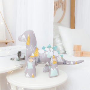 RubyBabyDesigns Keepsake Collective Duke the Dinosaur in mountain print. Jointed legs of wooden handmade engraved and faux leather spines, finished off with hand cut felt applique spots. Mountain print with grey, mustard, white, aqua and navy within the print. Handmade in Melbourne. Created with environmentally friendly PET fill.