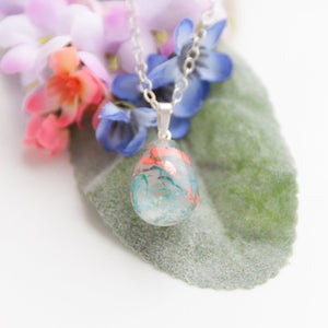 RubyBabyDesigns Keepsake Collective Memories in Threads Resin Teardrop pendant using inclusions such as loved ones clothing, fabrics, cremation ashes, preserved breastmilk, preserved flowers, locks of hair etc, handmade, made in melbourne, hand crafted.