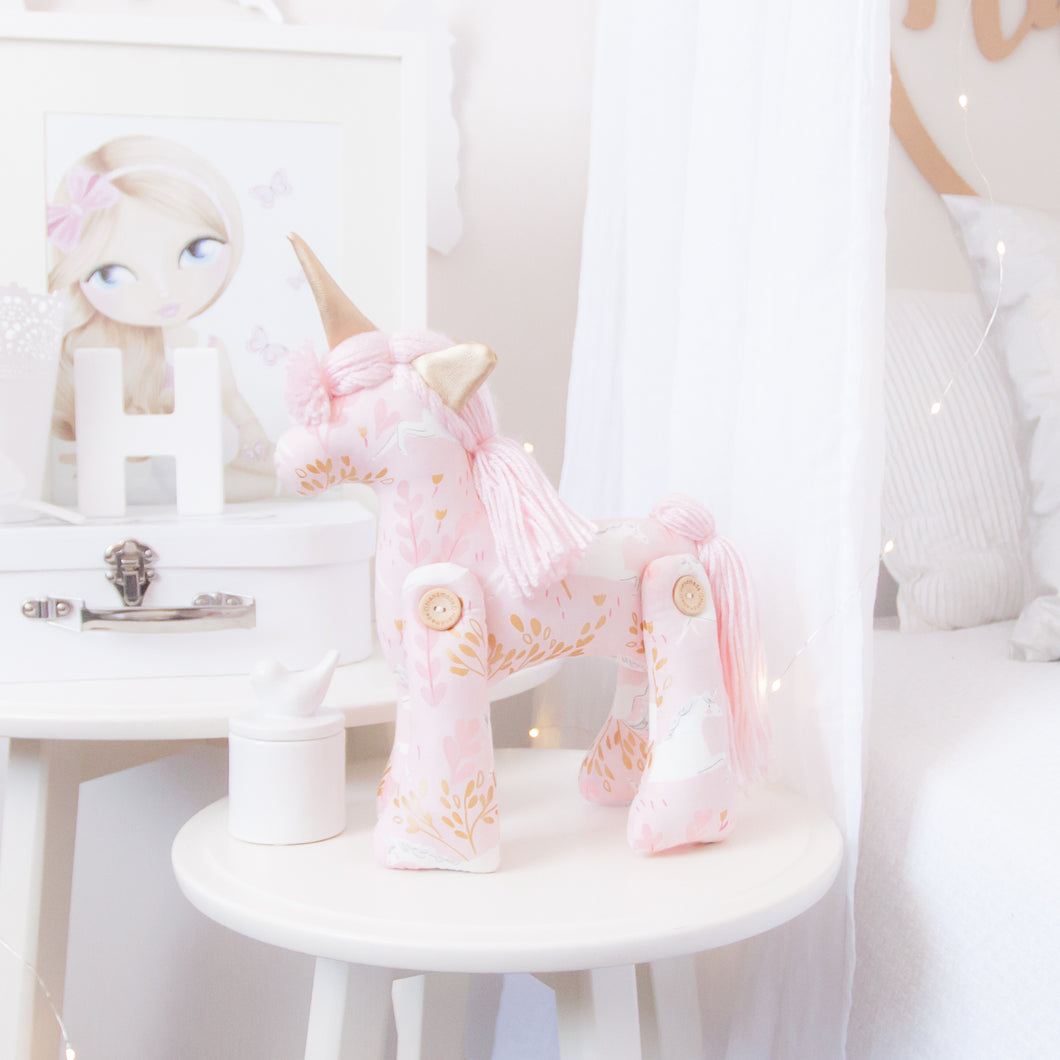 RubyBabyDesigns heirloom cloth doll, unity the unicorn, unicorn, pegasus, horse, faux leather, rag doll, cloth decor, heirloom, keepsake, handmade, made in melbourne, wooden buttons, buttons, leaves, unicorns, pink, gold, wool, metallic, white, light pink