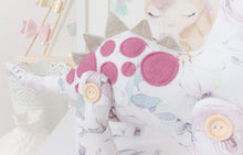 Load image into Gallery viewer, RubyBabyDesigns Keepsake Collective Heirloom Luxe Cloth Dinosaur Keepsake, created with luxurious digital printed cotton. Faux leather in a champagne colour for back spines, and wool blend plum toned felt as applique spots. Stuffed with premiun PET fill and handmade and designed in melbourne. Featuring a soft watercolour digital floral print on the body with soft pinks, maroons, plums, greens and blues on a white base. 4 engraved wooden buttons on jointed legs. Heirloom Cloth Decor keepsakes.